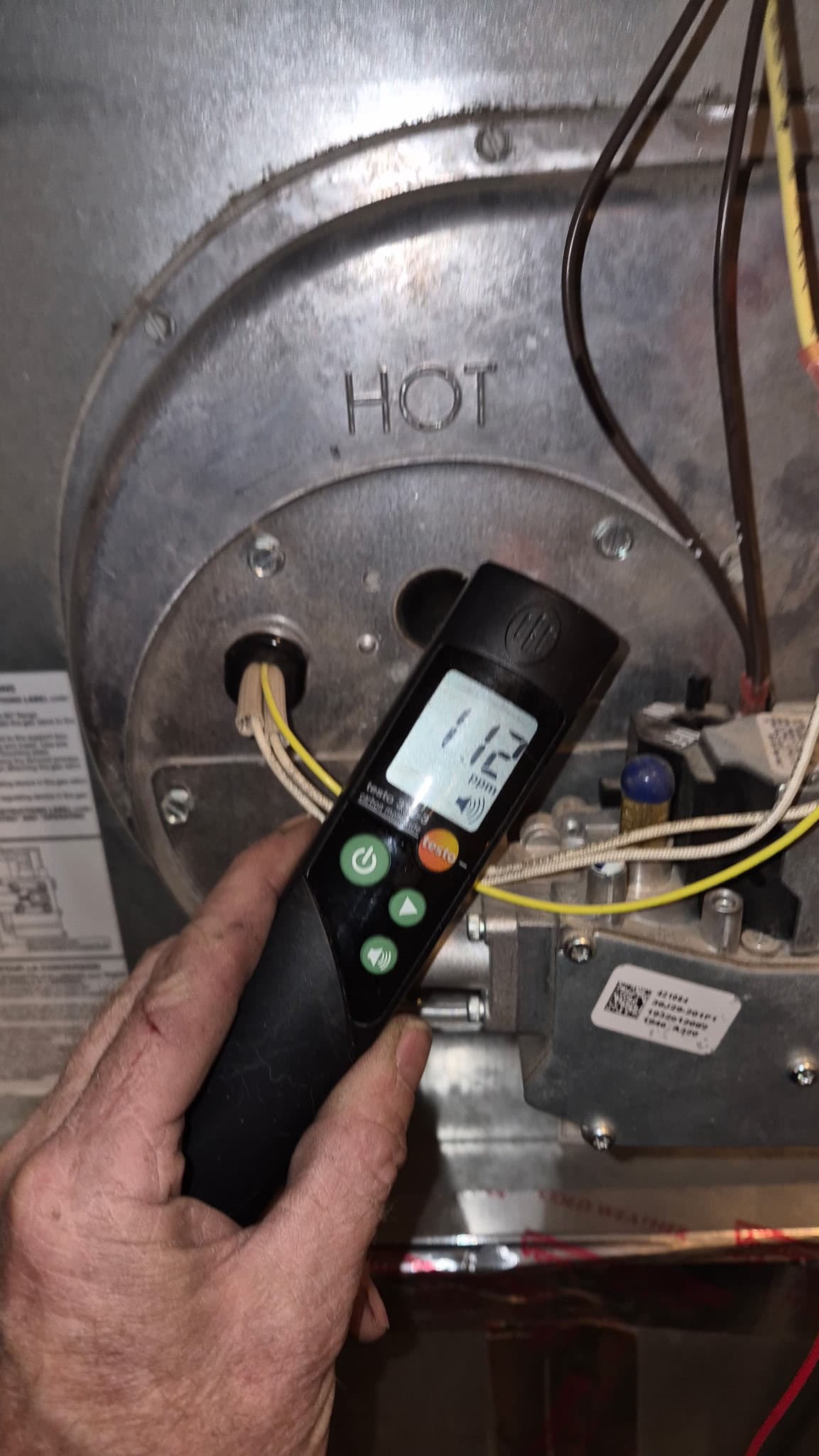 Technician using combustion analyzer on Denver furnace