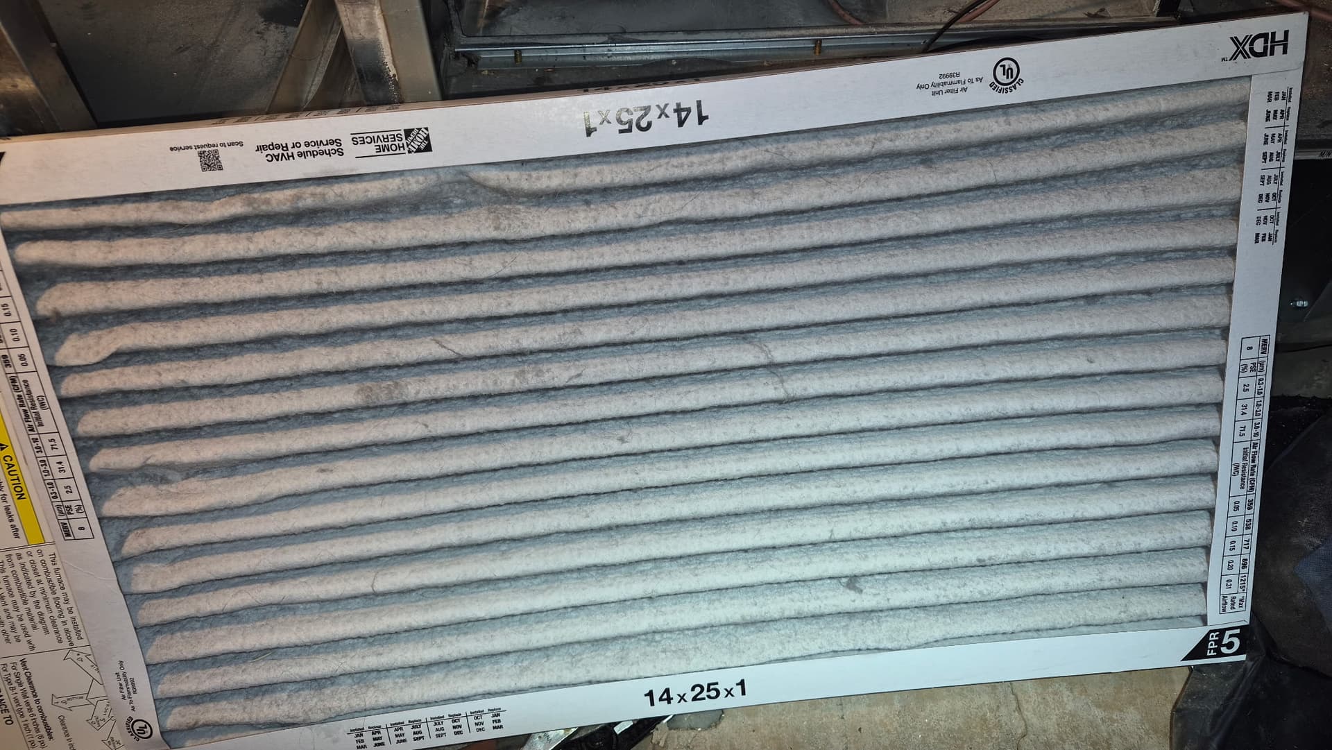 Clogged dirty HVAC air filter removed from Denver home furnace