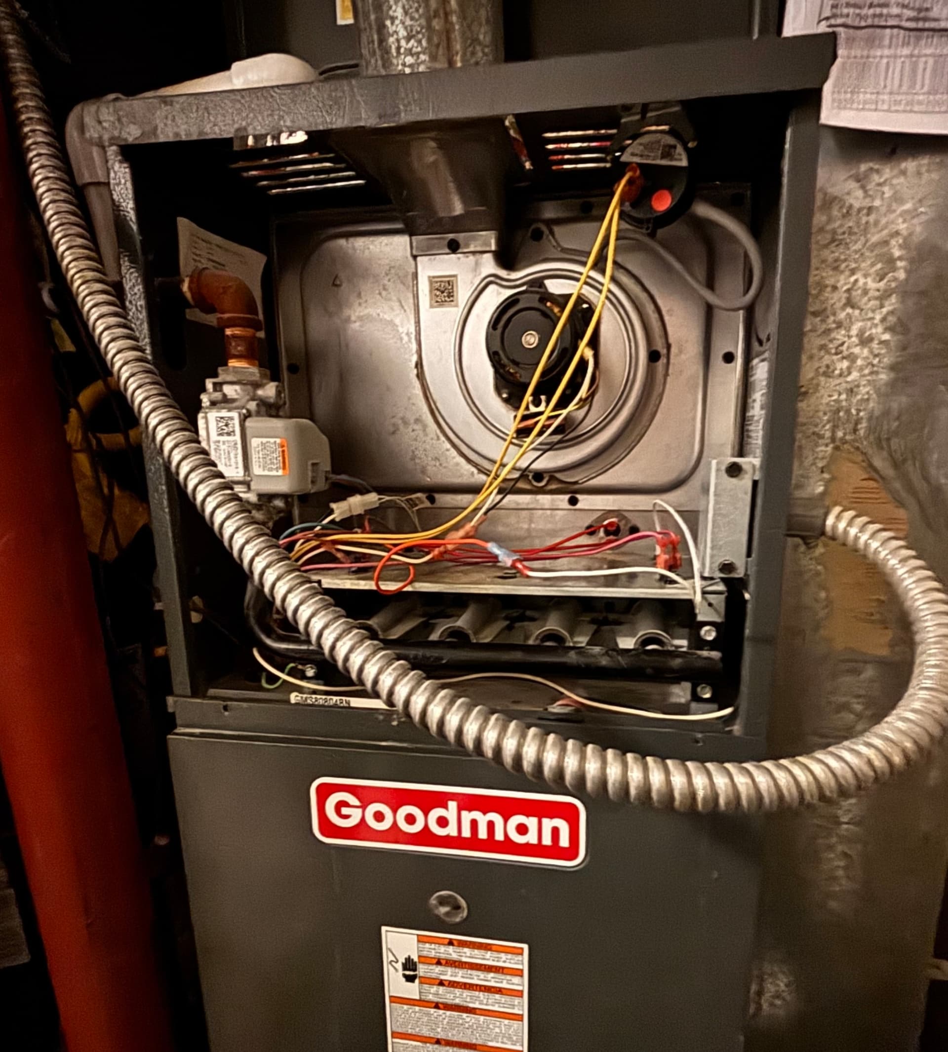 Goodman furnace open for repair showing inducer and heat exchanger