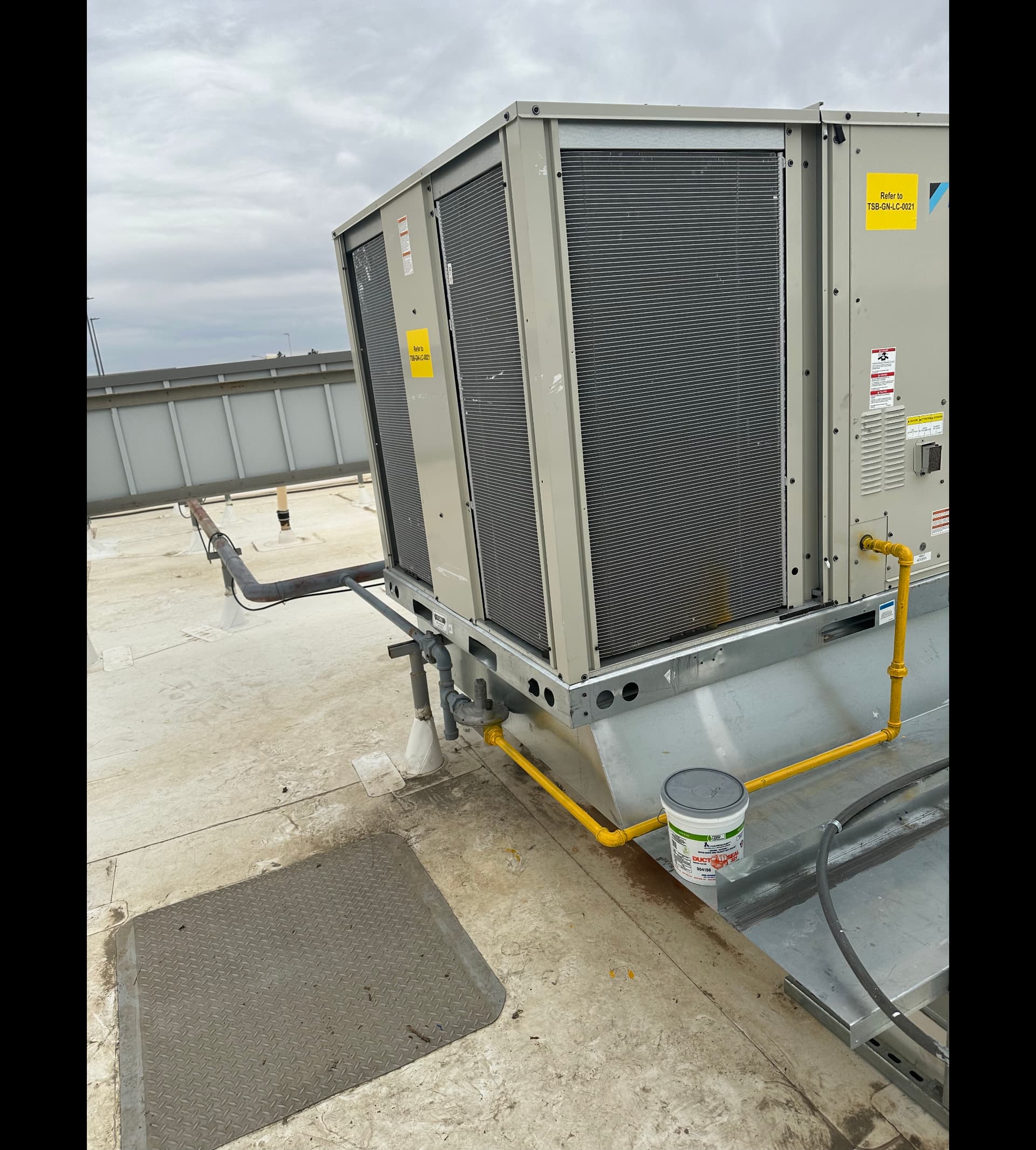 Daikin commercial rooftop HVAC unit on Denver flat roof