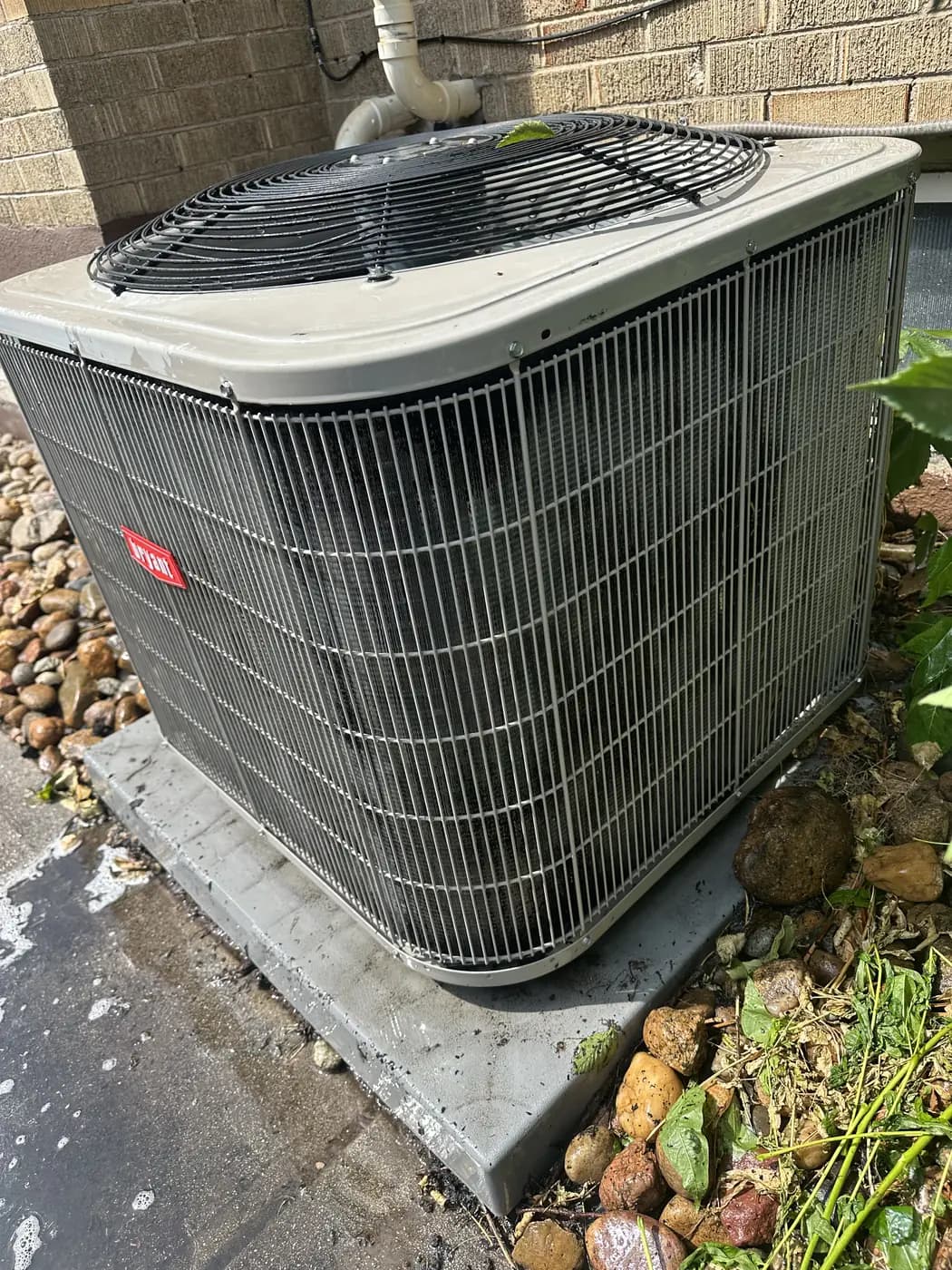 Bryant central air conditioner condenser installed beside a Denver home